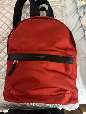 Michael Kors Red Backpack with Black Trim and Logo Bar